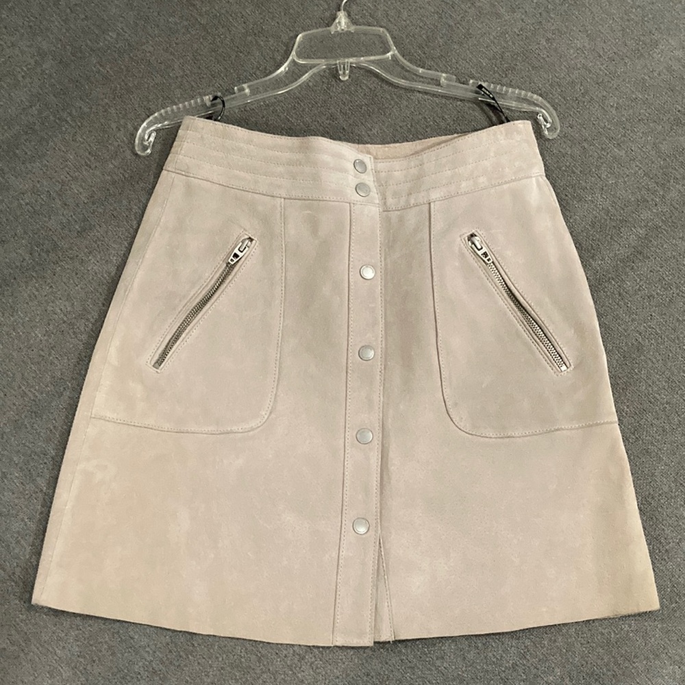 Cream colored leather mini skirt
